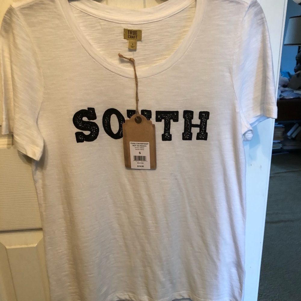 White shirt SOUTH on the front